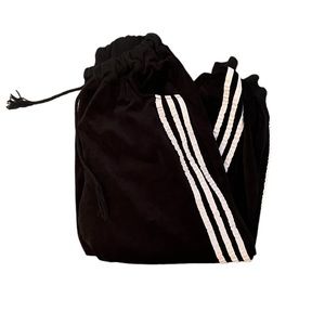 Black with white stripes on side and drawstring Sweatpants in size Small